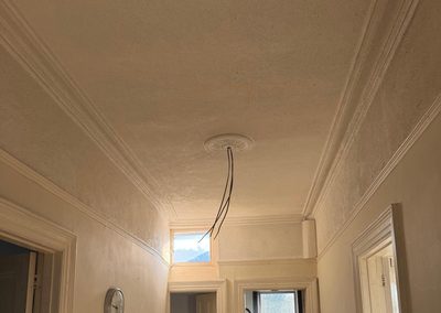 Landing ceiling rose rewired during a house rewire